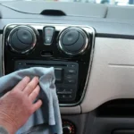 Volkswagen Jetta interior with a driver pairing a phone to the center screen
