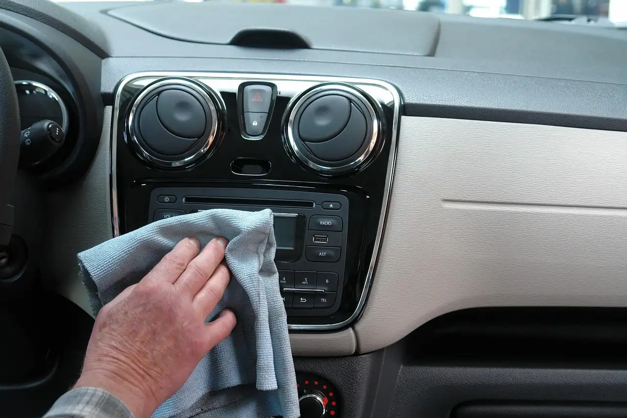 Volkswagen Jetta interior with a driver pairing a phone to the center screen