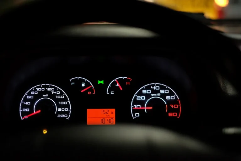 VW Jetta interior with driver using dashboard controls to reset the oil change light
