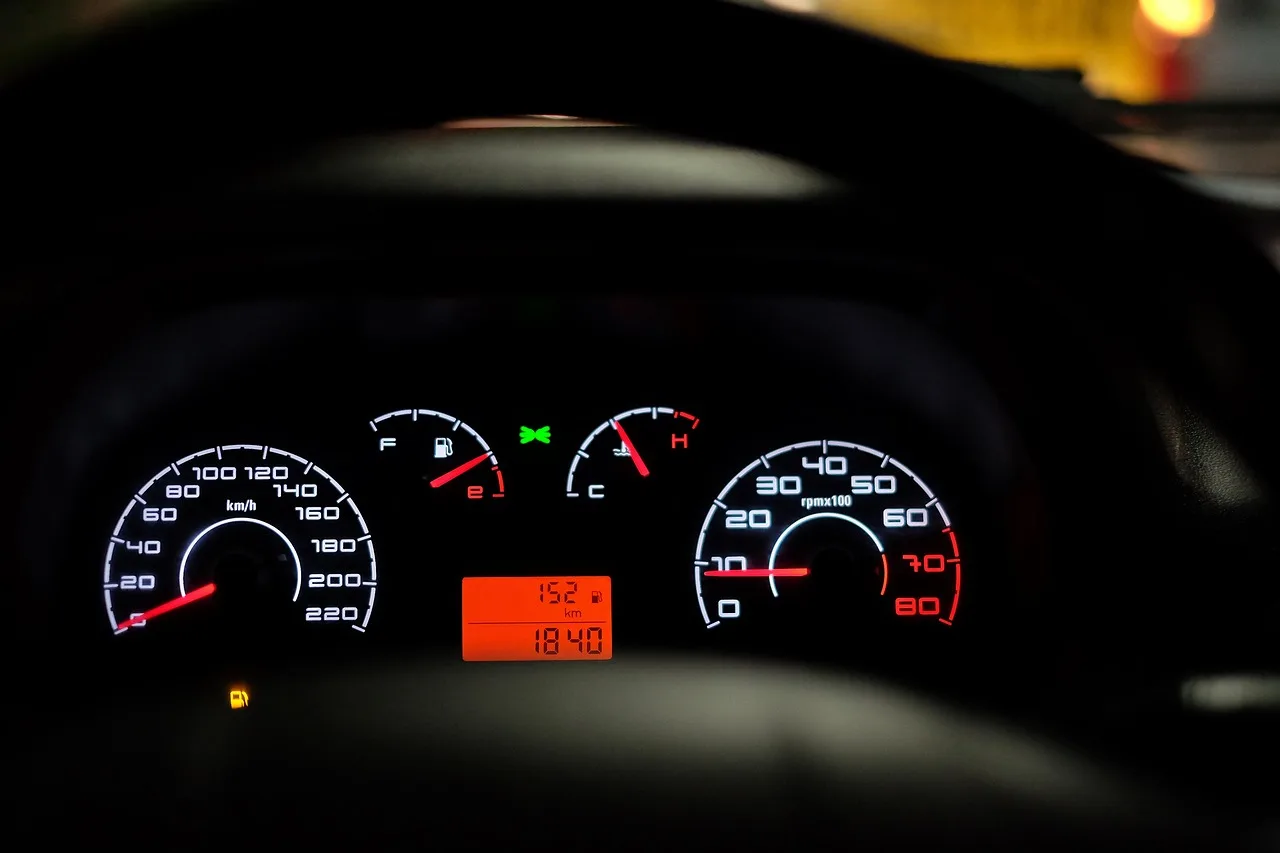 VW Jetta interior with driver using dashboard controls to reset the oil change light