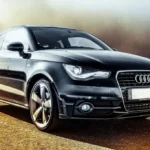 Used Volvo S60 and Audi A4 parked side by side with a buyer and mechanic comparing them